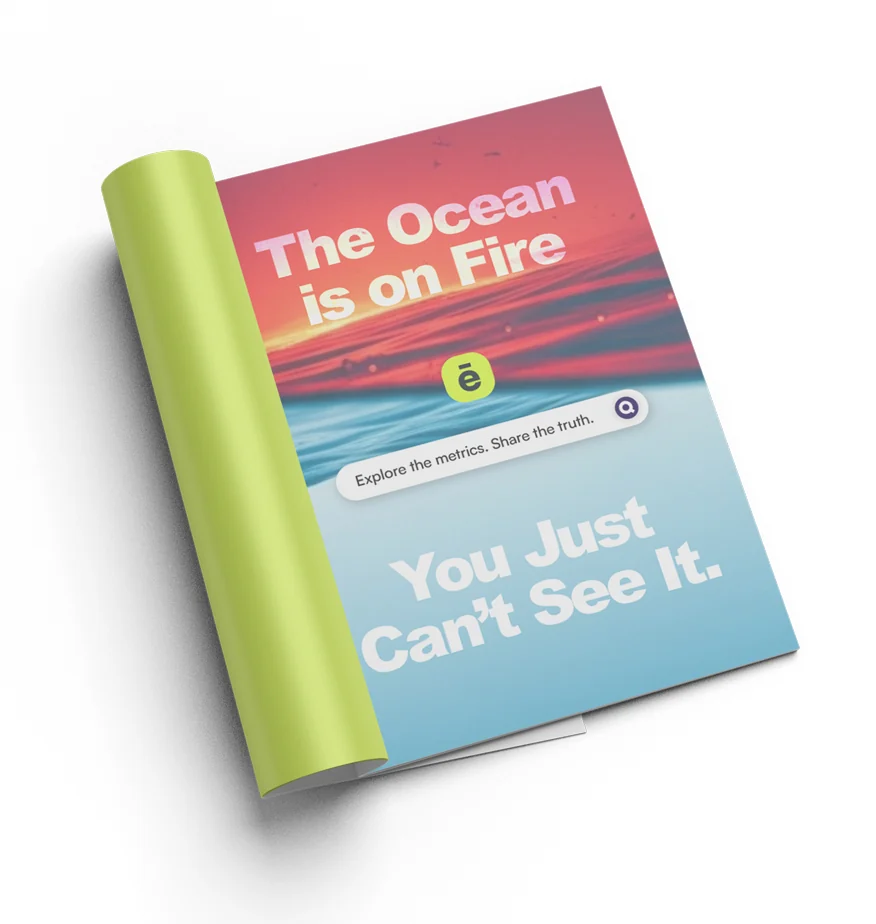A magazine open to a full-page Planēo ad: a burning red sea over calm blue water, “The Ocean is on Fire” above the app’s search bar reading “Explore the metrics. Share the truth.”, and “You Just Can’t See It.” below